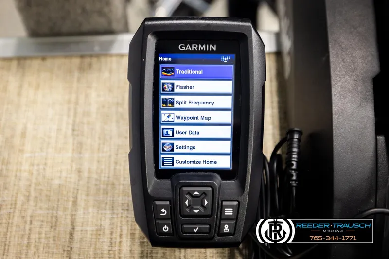 Slide: The Image of Garmin marine device displaying menu options, featuring traditional sonar and settings. - 50