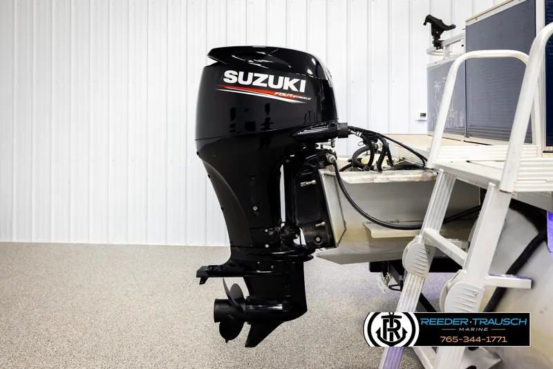 Slide: The Image of Suzuki outboard motor on 2020 Avalon VEN FNC boat, indoor setting. - 53