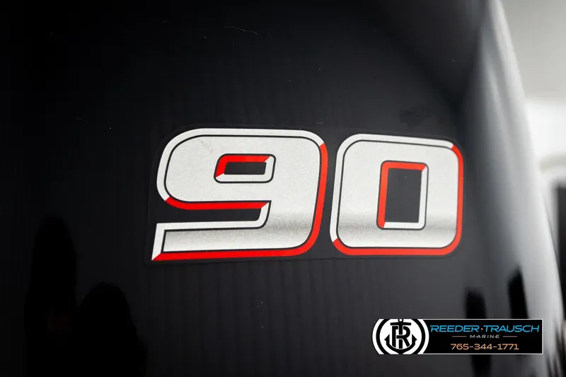 Slide: The Image of Close-up of '90' decal on 2020 Avalon VEN FNC, Reeder-Trausch Marine logo visible. - 55