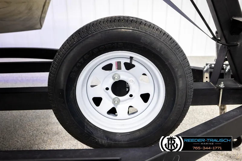 Slide: The Image of Trailer wheel on Avalon VEN FNC 2020, featuring white rim and black tire. - 57