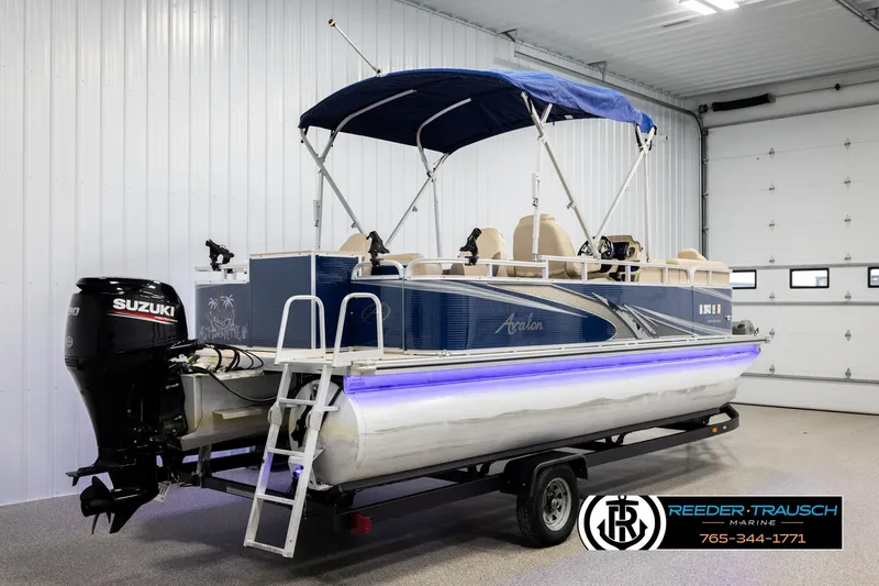 Slide: The Image of 2020 Avalon VEN FNC pontoon boat with Suzuki motor in a showroom. - 6