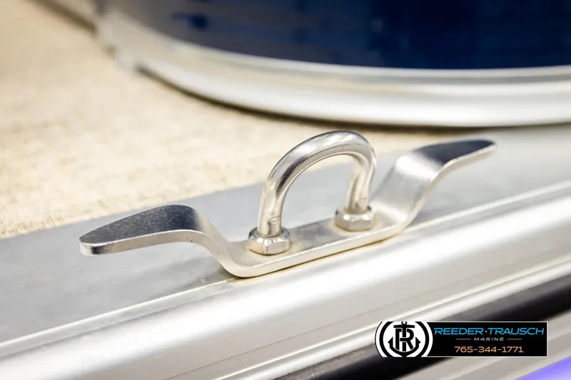 Slide: The Image of Close-up of a 2020 Avalon VEN FNC boat cleat, featuring Reeder-Trausch Marine branding. - 60