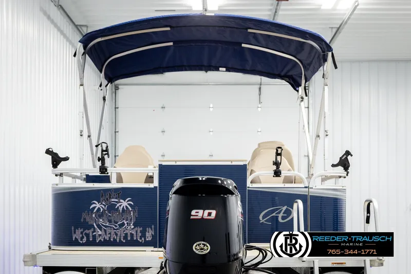 Slide: The Image of 2020 Avalon VEN FNC pontoon boat with canopy in a storage facility. - 7