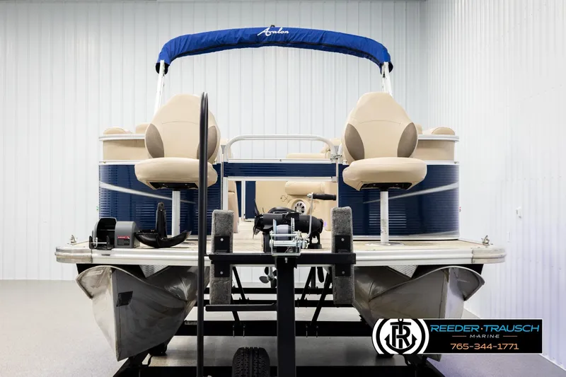 Slide: The Image of 2020 Avalon VEN FNC pontoon boat on trailer in indoor storage facility. - 8