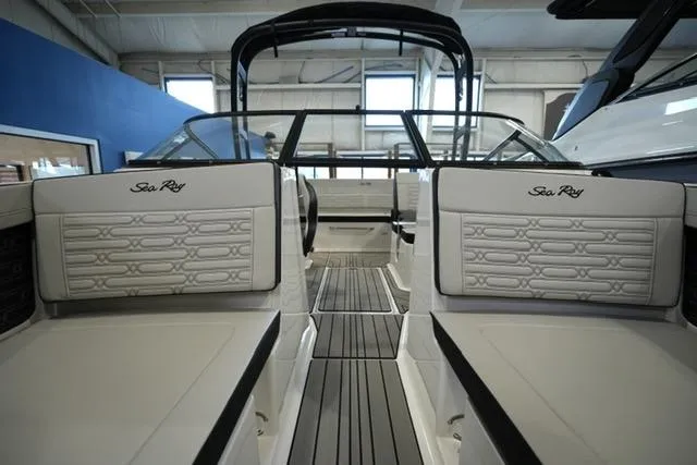 Slide: The Image of 2026 Sea Ray SPX 210 boat interior with sleek seating and modern design. - 14
