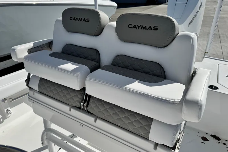 Slide: The Image of 2026 Caymas 28 HB boat seating with gray and white cushioned design. - 17