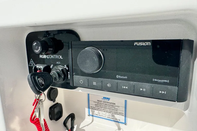 Slide: The Image of Control panel of 2026 Caymas 28 HB boat with Fusion audio system. - 19