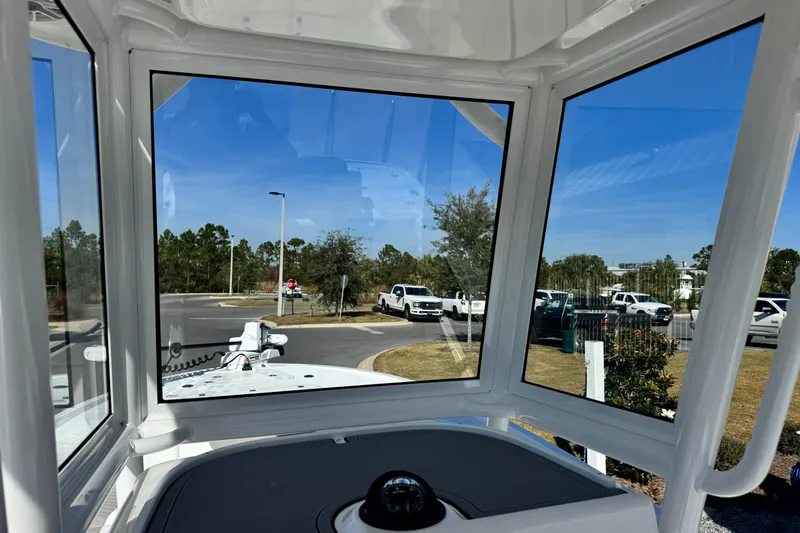 Slide: The Image of Interior view from 2026 Caymas 28 HB boat, showcasing windows and outdoor scenery. - 21