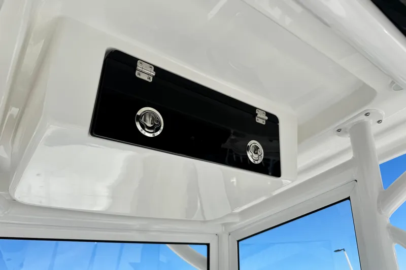 Slide: The Image of 2026 Caymas 28 HB boat interior storage compartment with sleek design and secure latches. - 22