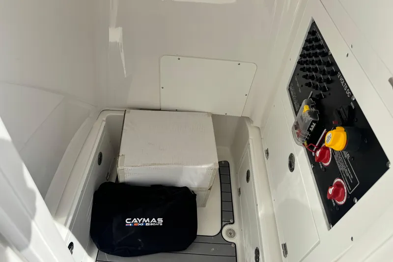 Slide: The Image of Interior of 2026 Caymas 28 HB boat showing storage and control panel. - 24