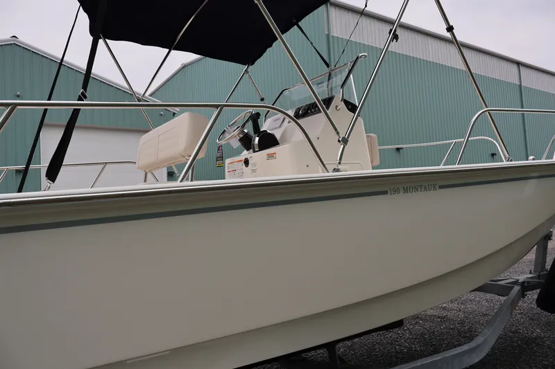 Slide: The Image of 2026 Boston Whaler 190 Montauk boat on trailer, side view. - 11
