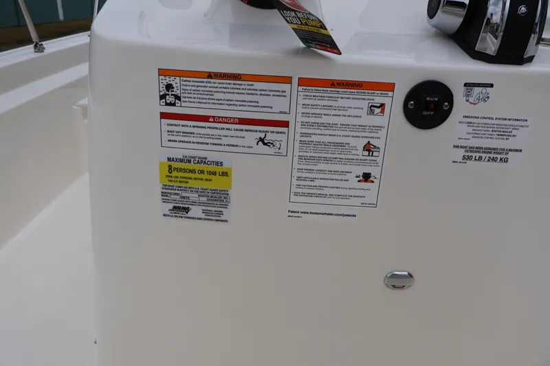 Slide: The Image of 2026 Boston Whaler 190 Montauk console with safety and capacity warnings. - 16