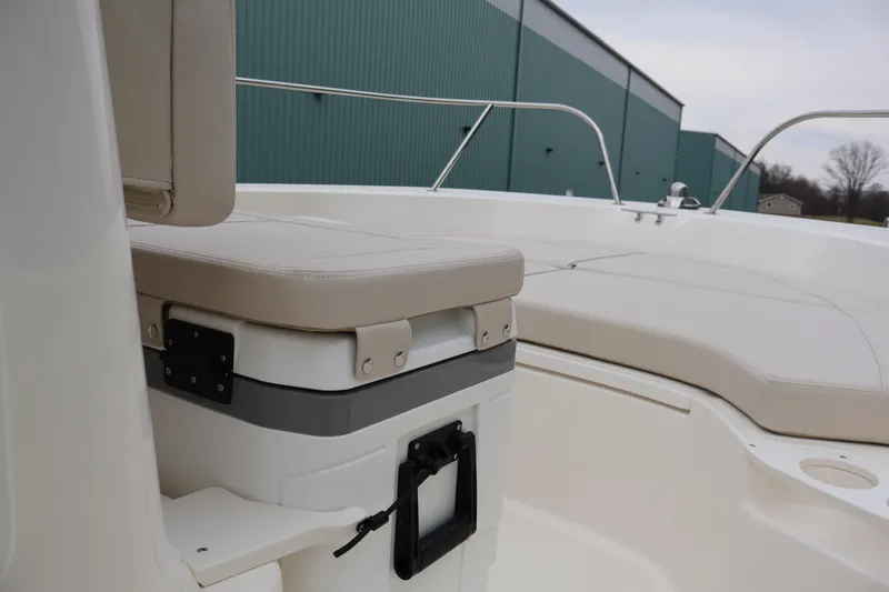Slide: The Image of 2026 Boston Whaler 190 Montauk boat interior with cushioned seating and storage. - 19