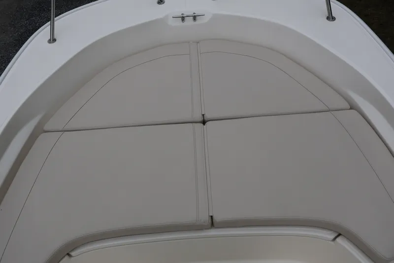 Slide: The Image of Bow seating area of 2026 Boston Whaler 190 Montauk boat with cushioned upholstery. - 23