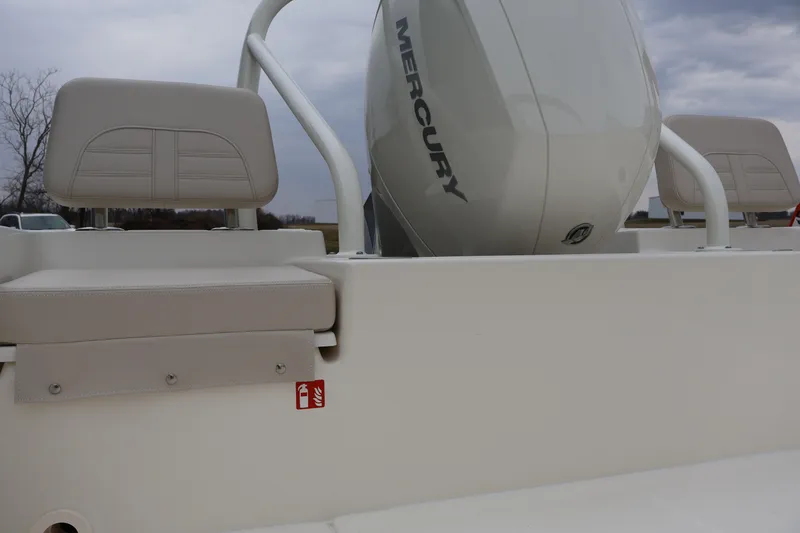 Slide: The Image of 2026 Boston Whaler 190 Montauk boat with Mercury engine and beige seating. - 32