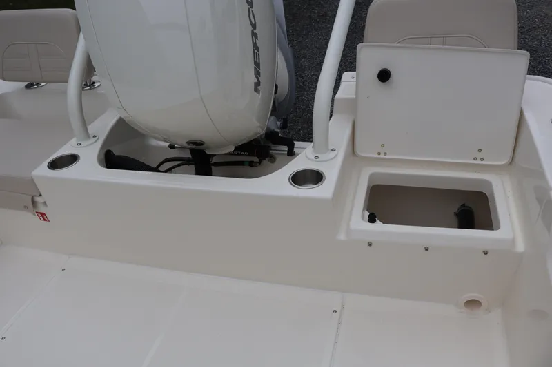 Slide: The Image of 2026 Boston Whaler 190 Montauk boat engine area with storage compartments. - 34
