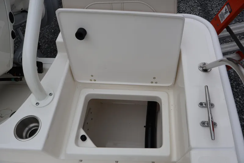 Slide: The Image of Open storage compartment on a 2026 Boston Whaler 190 Montauk boat deck. - 36