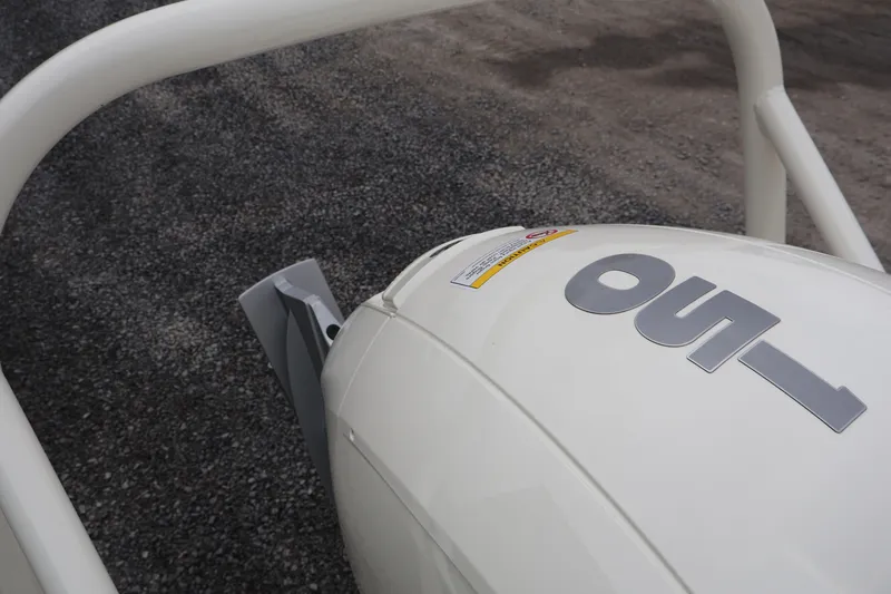 Slide: The Image of Close-up of a 2026 Boston Whaler 190 Montauk outboard motor on gravel. - 7