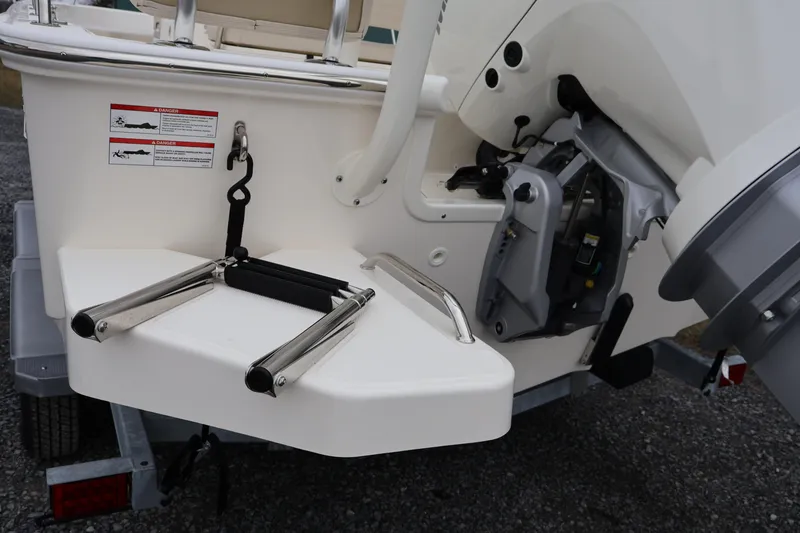 Slide: The Image of 2026 Boston Whaler 190 Montauk boat with ladder and motor detail. - 9
