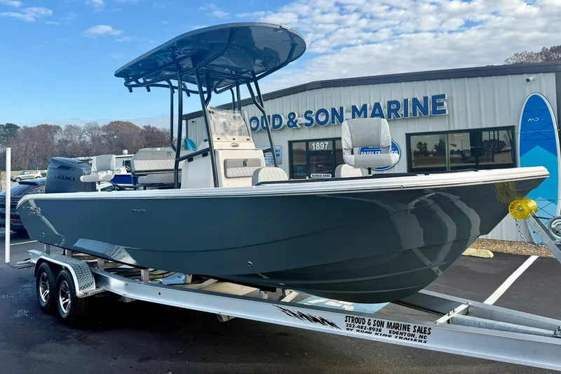 Slide: The Image of 2026 Carolina Skiff 26 Ultra Elite boat on trailer at marine dealership. - 10