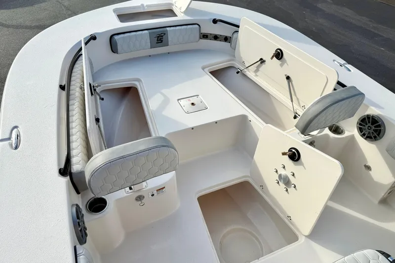 Slide: The Image of 2026 Carolina Skiff 26 Ultra Elite boat interior with seating and storage compartments. - 15