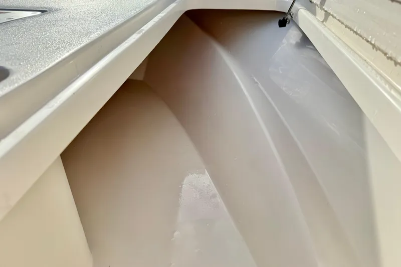 Slide: The Image of Interior view of 2026 Carolina Skiff 26 Ultra Elite boat compartment. - 17