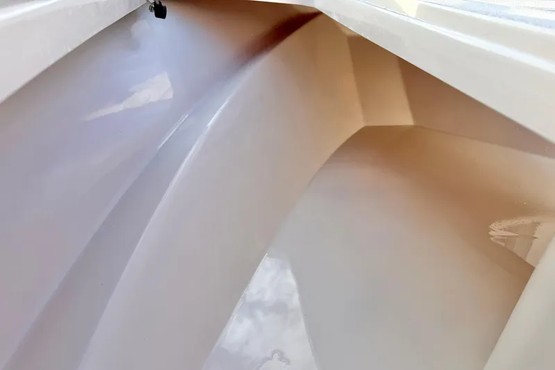 Slide: The Image of Interior view of 2026 Carolina Skiff 26 Ultra Elite boat compartment. - 18