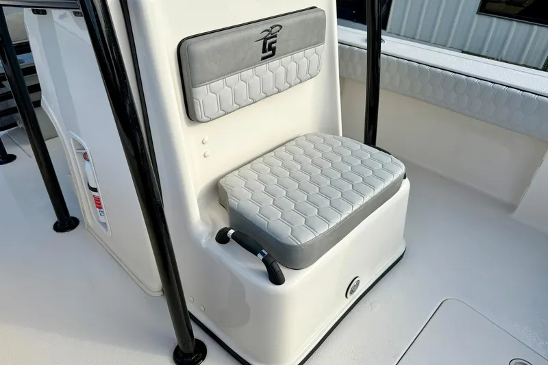 Slide: The Image of 2026 Carolina Skiff 26 Ultra Elite boat seat with hexagonal pattern upholstery. - 20