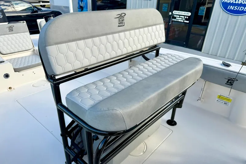 Slide: The Image of 2026 Carolina Skiff 26 Ultra Elite boat seating with hexagonal pattern upholstery. - 23