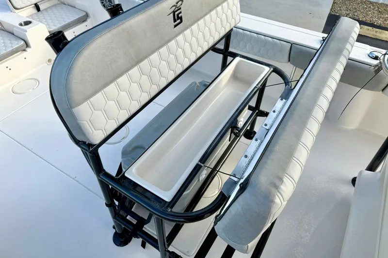 Slide: The Image of 2026 Carolina Skiff 26 Ultra Elite boat seating with storage compartment. - 25