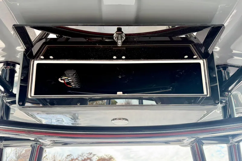 Slide: The Image of 2026 Carolina Skiff 26 Ultra Elite boat console storage compartment. - 28