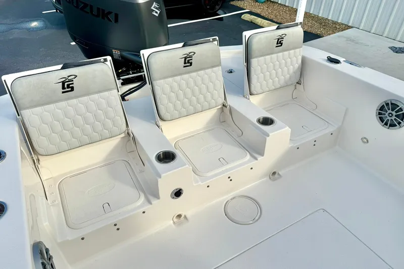 Slide: The Image of 2026 Carolina Skiff 26 Ultra Elite boat seating with Suzuki engine in background. - 34