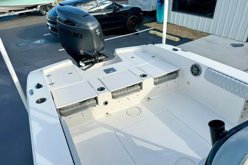 Slide: The Image of 2026 Carolina Skiff 26 Ultra Elite boat with Suzuki outboard motor, spacious deck layout. - 38