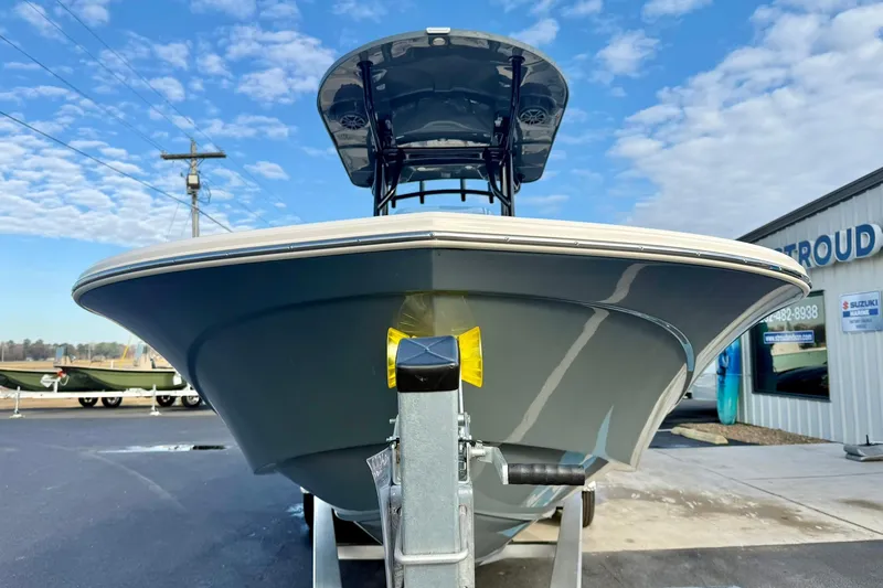 Slide: The Image of 2026 Carolina Skiff 26 Ultra Elite boat on trailer under blue sky. - 8