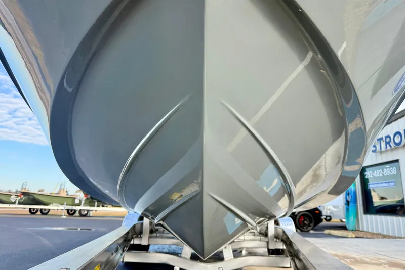 Slide: The Image of 2026 Carolina Skiff 26 Ultra Elite boat hull on trailer, showcasing sleek design. - 9