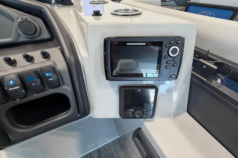 Slide: The Image of 2026 Bentley Pontoons Legacy 243 Swingback dashboard with Humminbird electronics and control panel. - 10