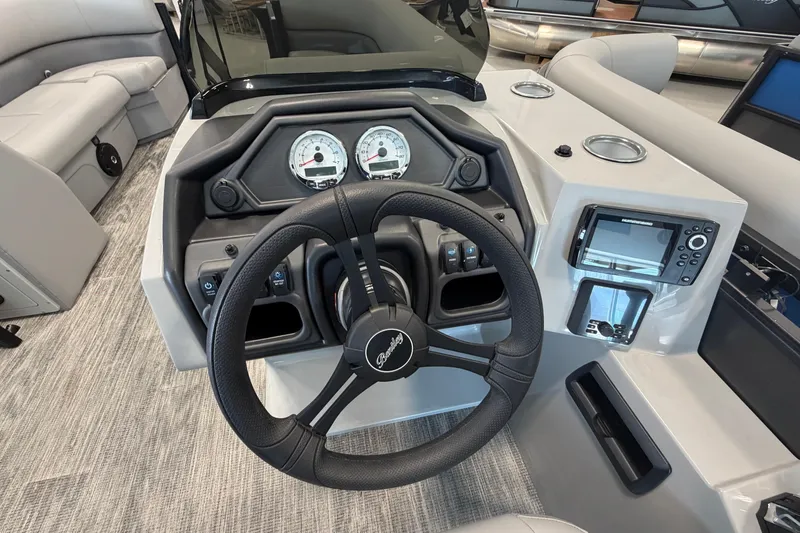 Slide: The Image of 2026 Bentley Pontoons Legacy 243 Swingback dashboard with steering wheel and gauges. - 12