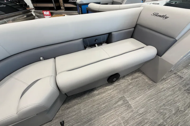 Slide: The Image of 2026 Bentley Pontoons Legacy 243 Swingback interior seating, showcasing luxurious gray upholstery. - 16