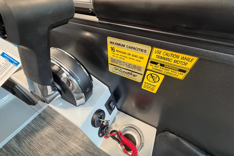Slide: The Image of Control panel of 2026 Bentley Pontoons Legacy 243 Swingback with capacity warnings. - 9