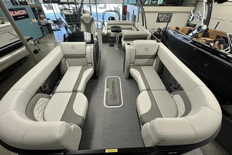 Slide: The Image of Luxurious interior of 2026 Godfrey Monaco 235 SFL pontoon boat with plush seating. - 11
