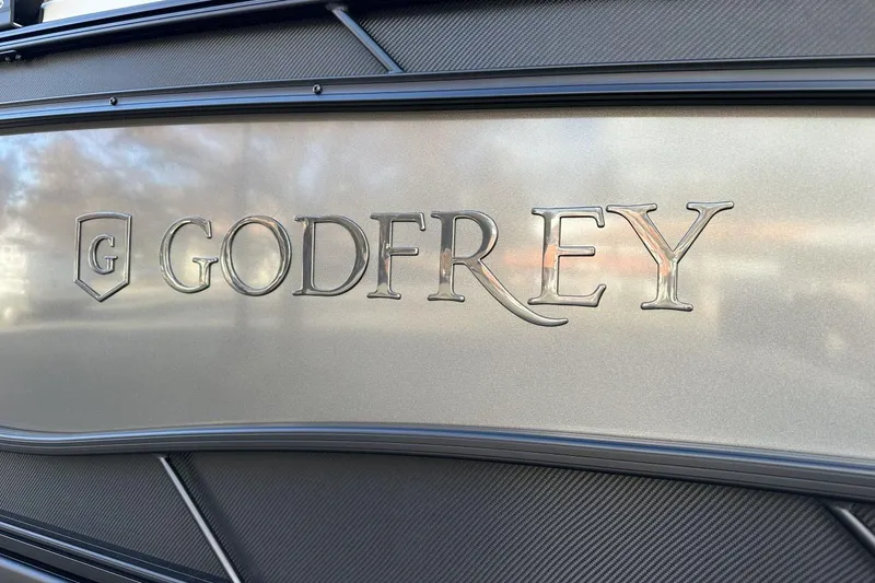 Slide: The Image of Godfrey Monaco 235 SFL 2026 logo on sleek metallic surface. - 2