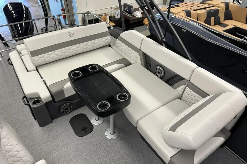 Slide: The Image of 2026 Godfrey Monaco 235 SFL boat interior with luxurious seating and cupholders. - 8