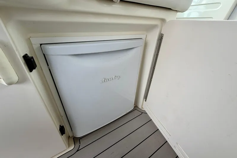 Slide: The Image of Mini fridge on 1995 Sea Ray 370 Sundancer boat, integrated into cabin interior. - 10