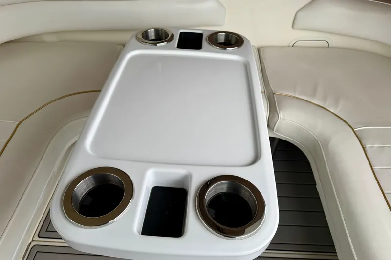 Slide: The Image of Cup holders and seating on a 1995 Sea Ray 370 Sundancer boat. - 20
