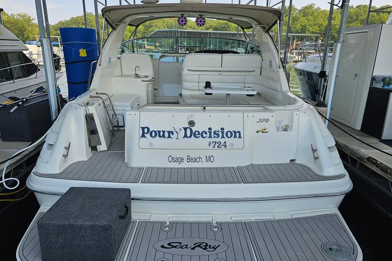 Slide: The Image of 1995 Sea Ray 370 Sundancer docked at Osage Beach, MO, with "Pour Decision" nameplate. - 3