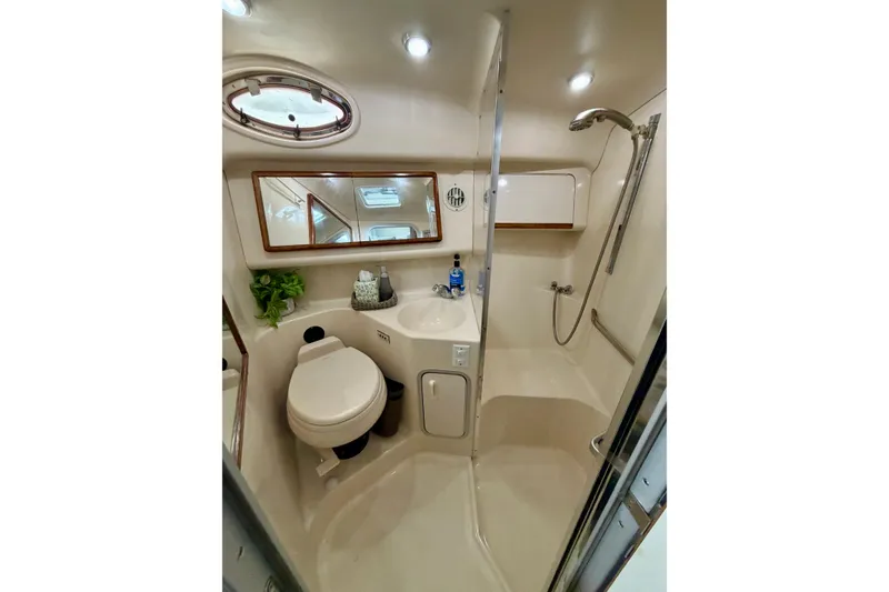 Slide: The Image of Bathroom interior of 1995 Sea Ray 370 Sundancer yacht, featuring shower and toilet. - 31