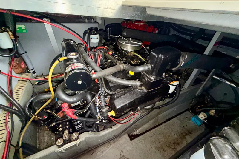 Slide: The Image of Engine compartment of a 1995 Sea Ray 370 Sundancer boat, showing detailed components. - 35
