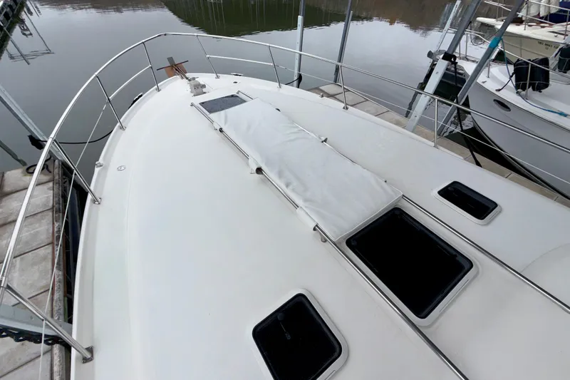 Slide: The Image of 1995 Sea Ray 370 Sundancer yacht deck with hatches, docked at marina. - 4