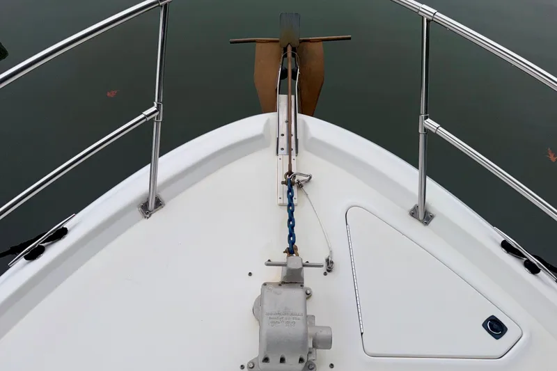 Slide: The Image of Bow of 1995 Sea Ray 370 Sundancer with anchor and railing. - 5