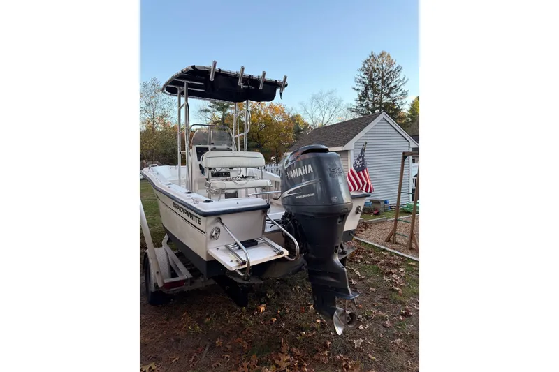 Slide: The Image of 2004 Grady-White Fisherman 180 boat with Yamaha engine, parked outdoors near a house. - 10
